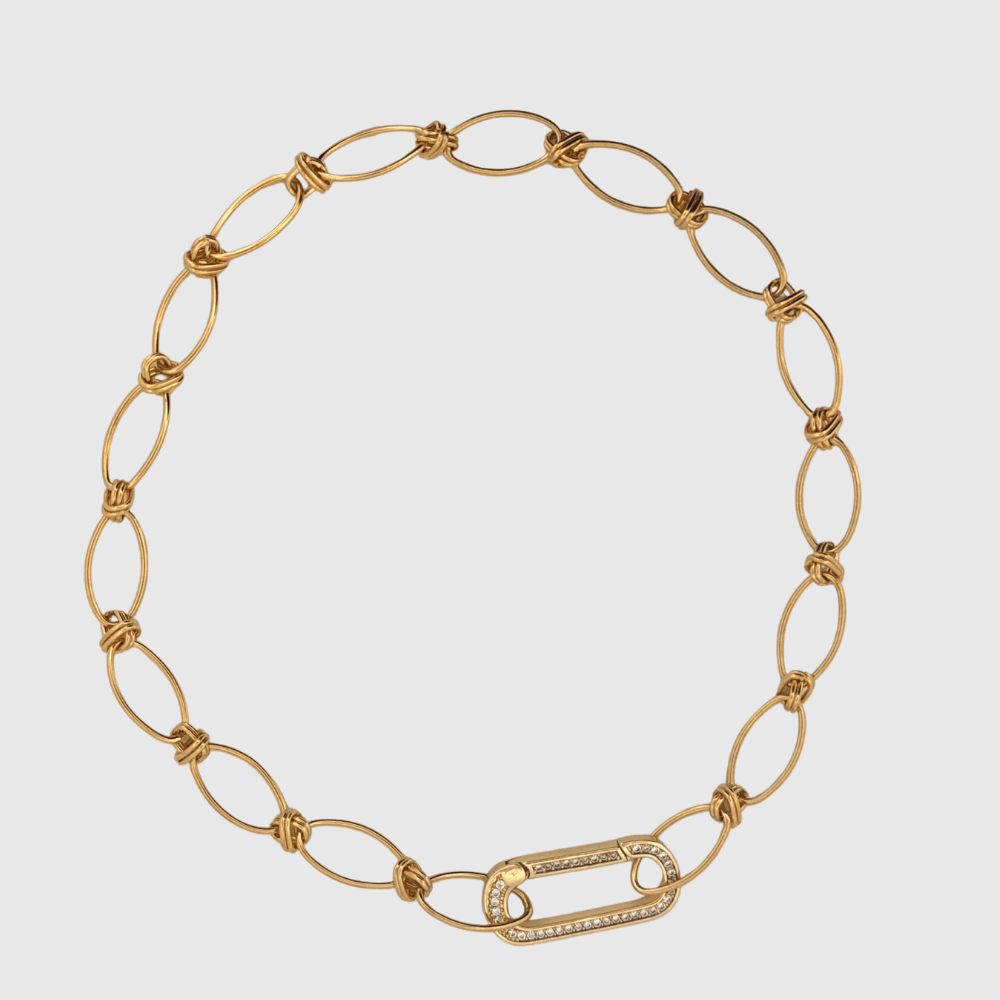 Gold oval link chain necklace with knot details and rectangular clasp, plated in 18K gold.